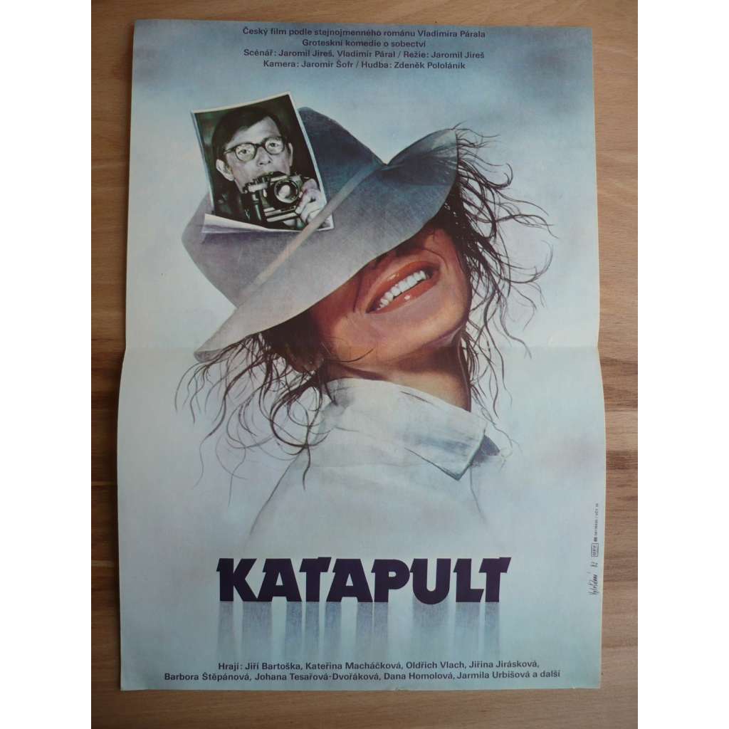 Katapult (filmový plakát, film ČSSR 1983, režie Jaromil Jireš, Hrají: Jiří Bartoška, Kateřina Macháčková, Jiřina Jirásková)